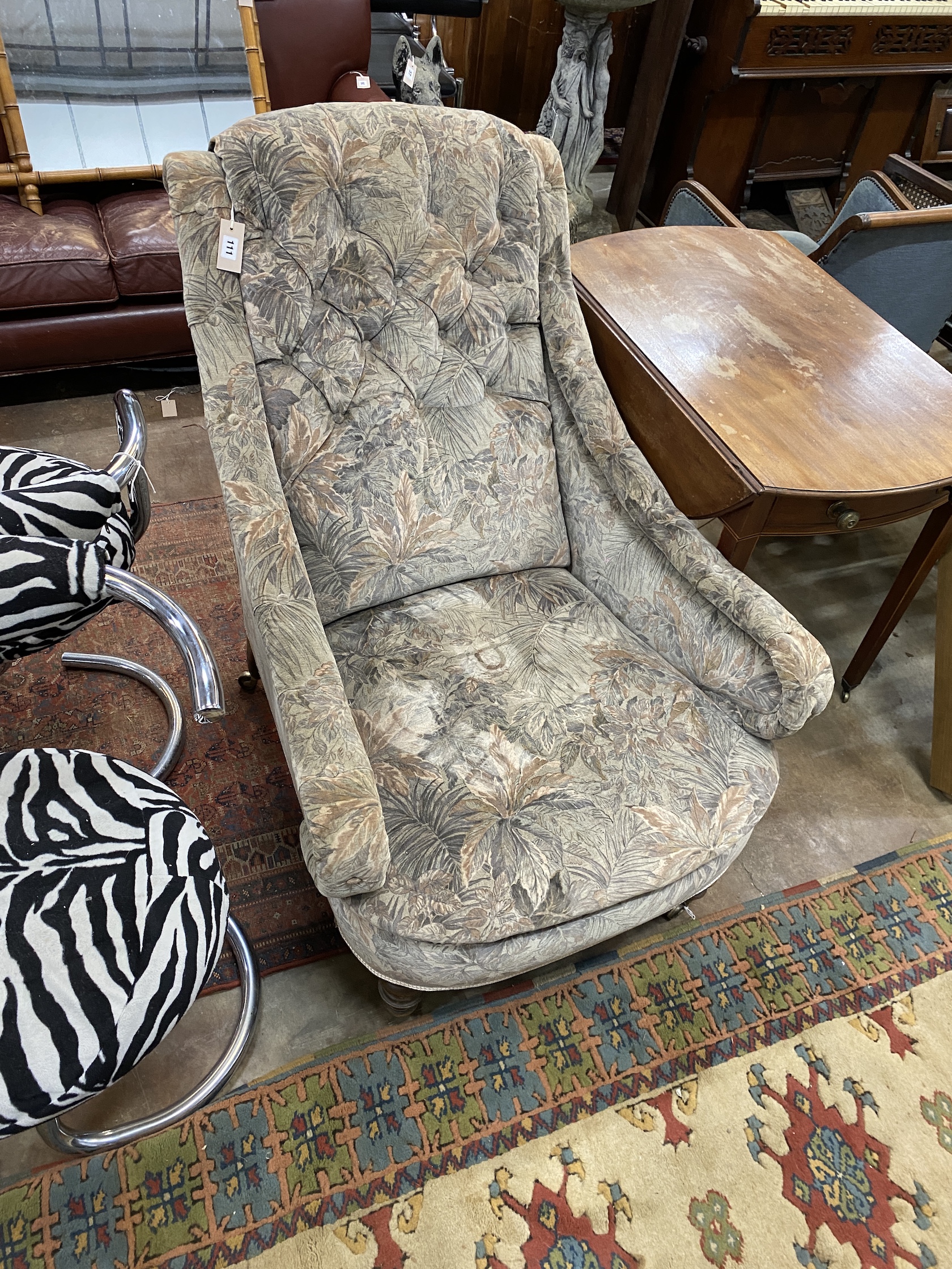 A Victorian walnut upholstered armchair, width 78cm, depth 110cm, height 94cm